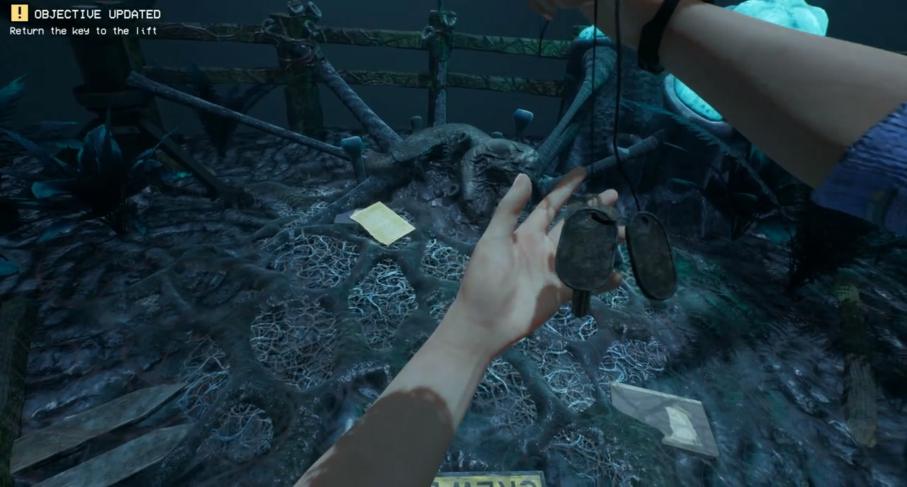 Crew lift key held after collection, beside a body and a note in Cavern B