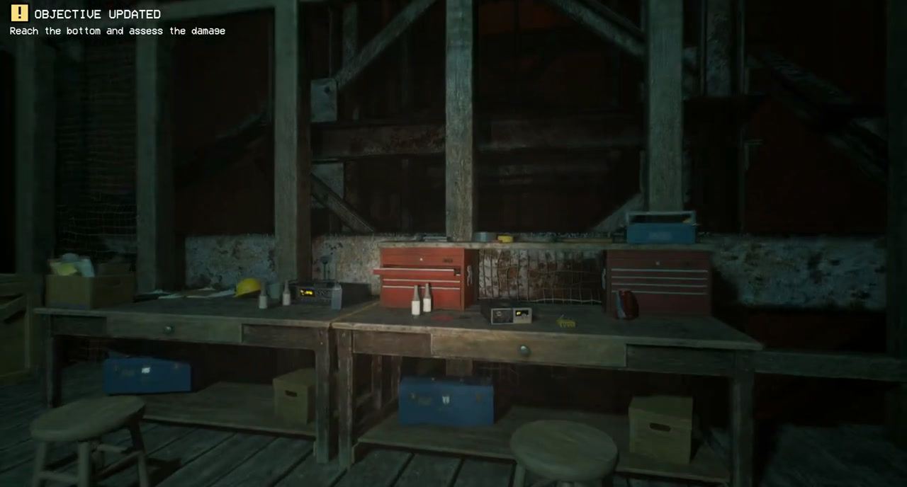 Workshop platform in the elevator shaft, with red toolboxes above the workbench